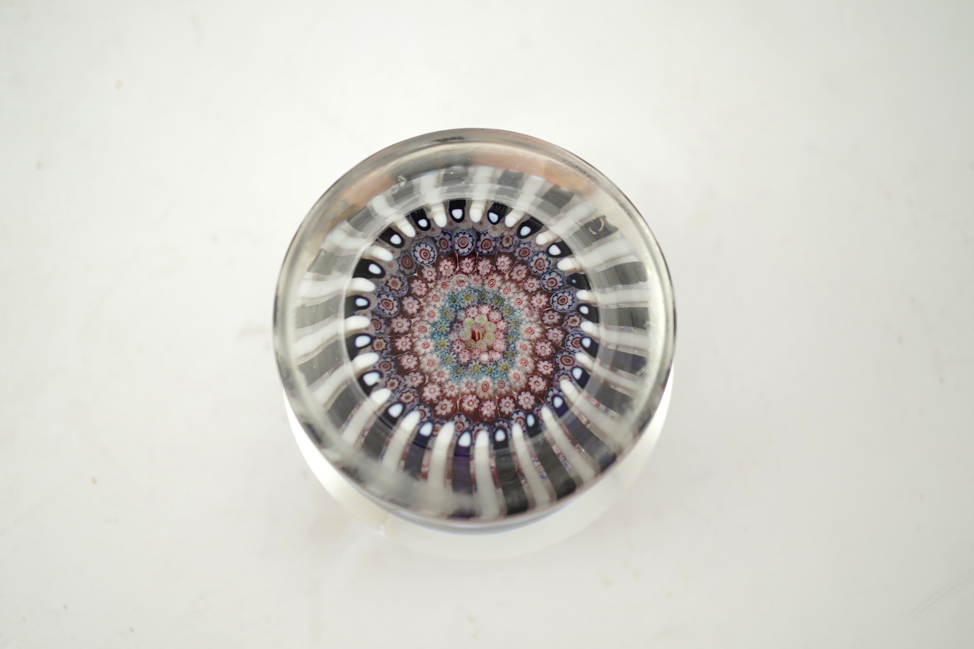 A Clichy piedouche concentric millefiori paperweight, mid 19th century